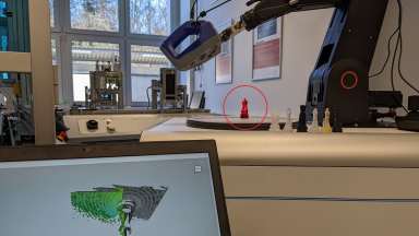 Das Bild veranschaulicht den Demonstrator Flexible, robotergestützte Scantechnik zur Qualitätskontrolle